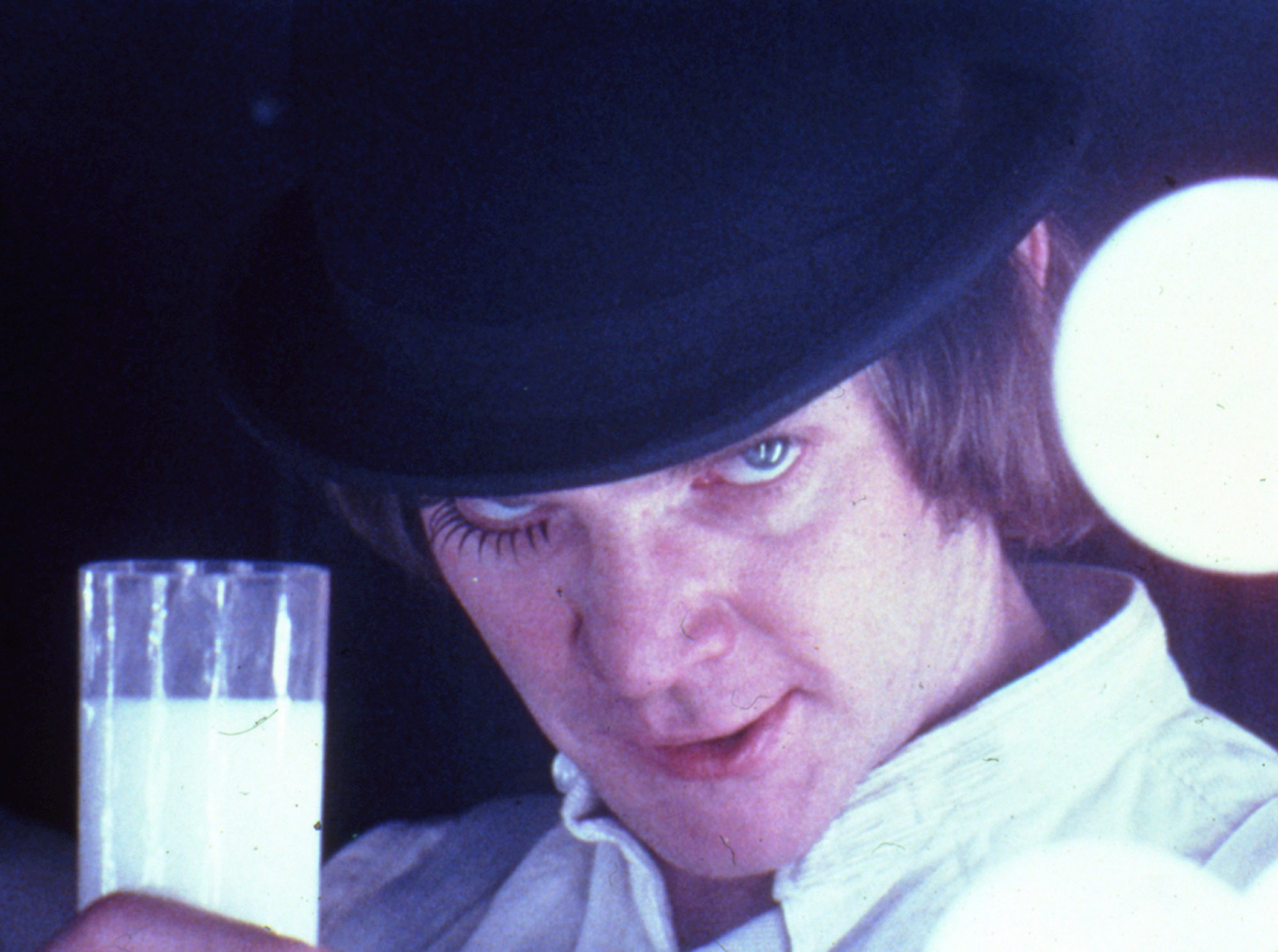 A Clockwork Orange, directed by Stanley Kubrick (1970-71; GB/United States). Alex DeLarge (Malcolm McDowell) in the Korova Milkbar. Still image. © Warner Bros. Entertainment Inc.