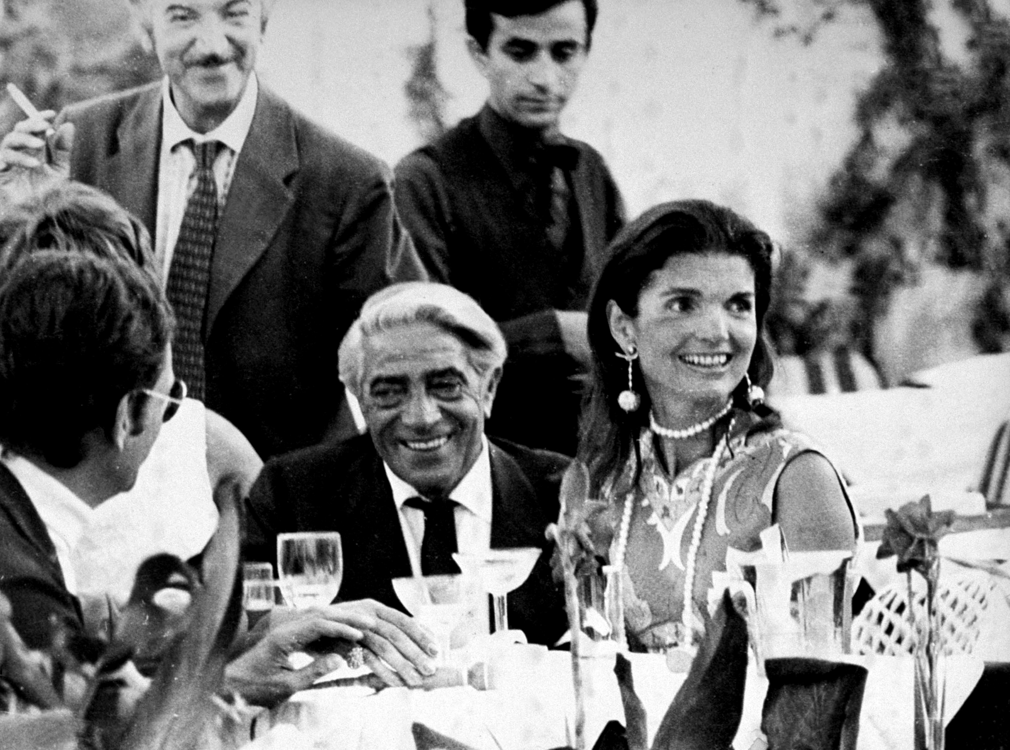 Aristotle Onassis with wife Jackie, who is wearing a pair of Lalaounis Apollo earrings, designed to commemorate the moon landing in 1969.