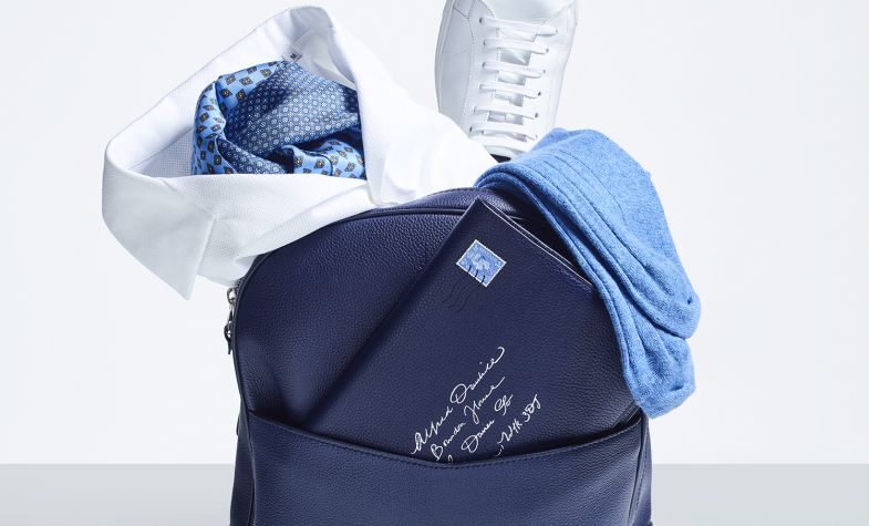 Boston rucksack, £1,150; stripe socks, £50; leather sneakers, £360; silk polo shirt, £195; printed scarf, £195; notebook, £315