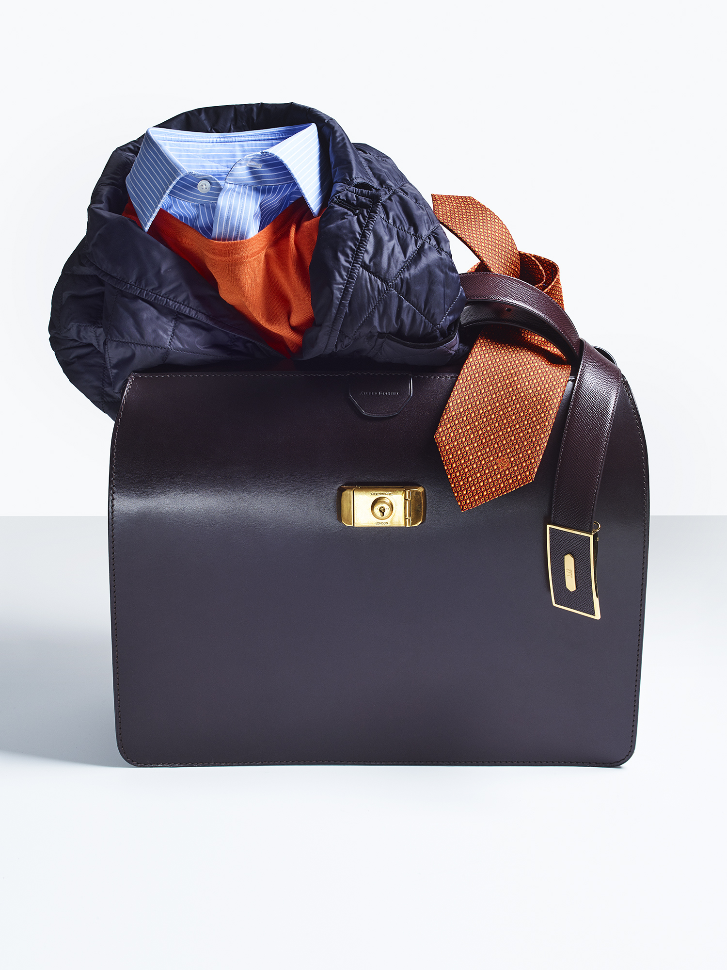 Wolsley bag, £3,395; quilted blazer, £695; crew neck, £275; stripe shirt, £195; leather belt, £230; tie, £125