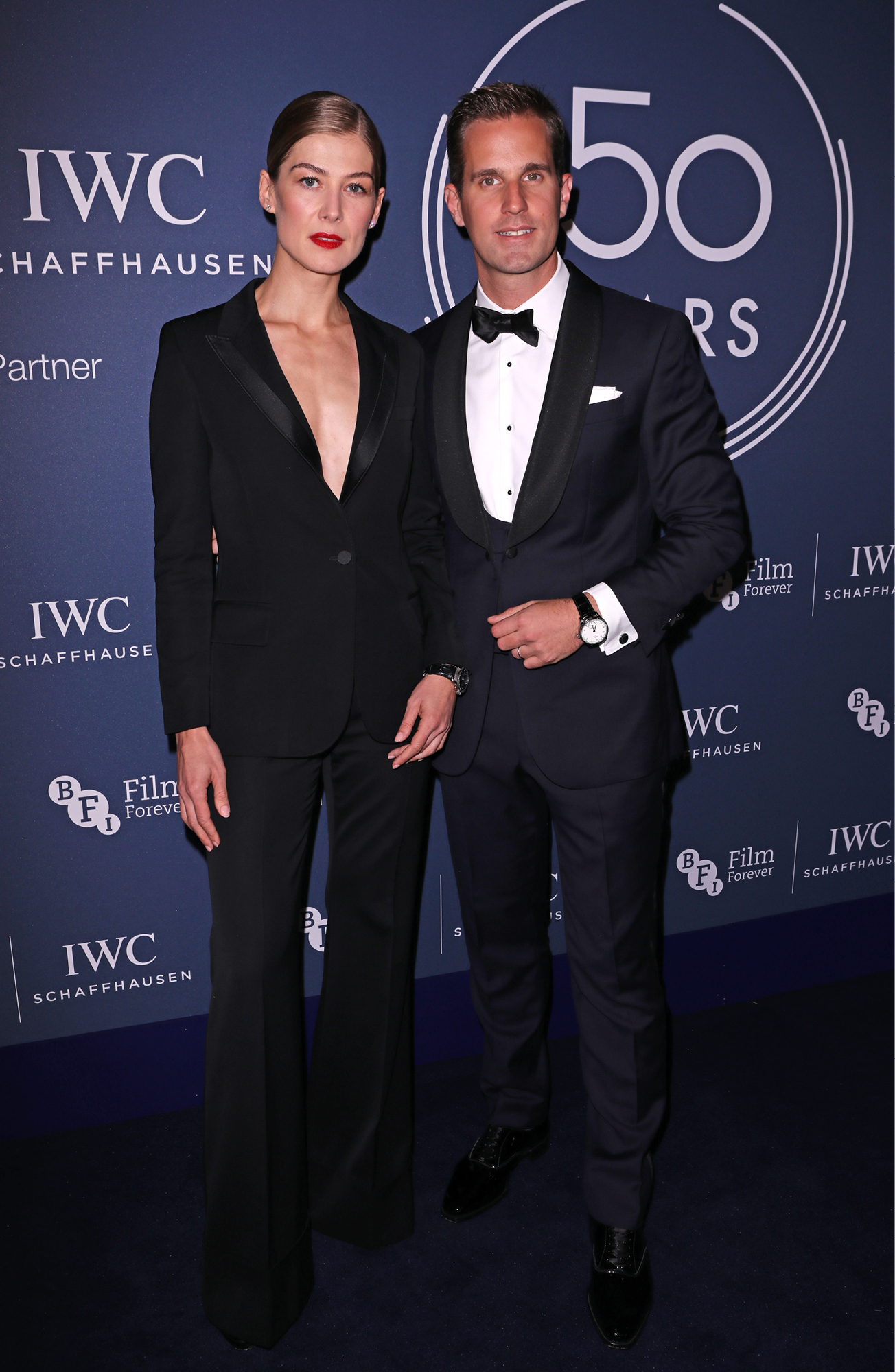 Rosamund Pike poses with IWC CEO Christoph Grainger-Herr