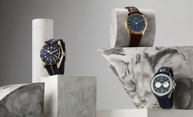 Bucherer Blue Editions - From left: Black Bay Bronze Blue 43mm, £2,860, TUDOR; Portugieser 42mm rose gold round dial automatic, £17,950, IWC; Polo S 42mm stainless steel cushion dial automatic, £11,400, PIAGET