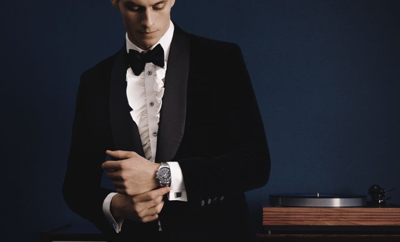 omega speedmaster with a suit
