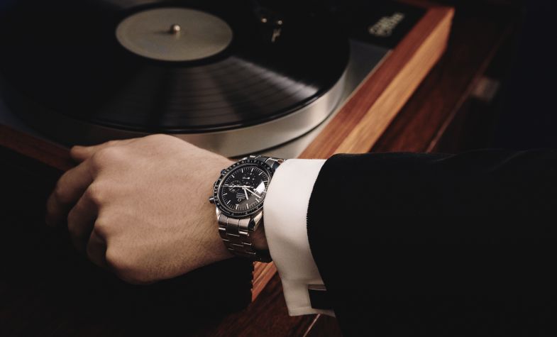 omega speedmaster with a suit