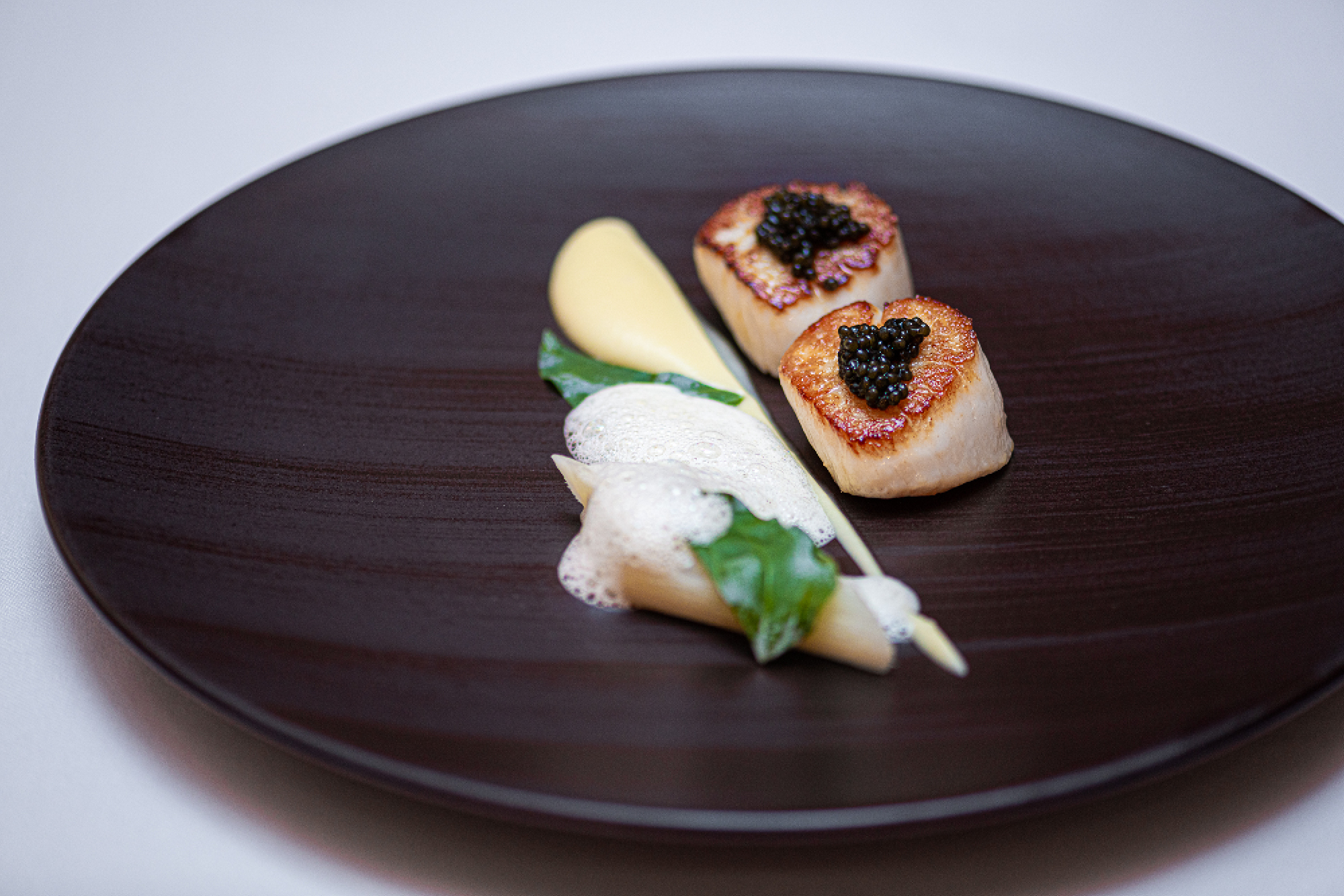 Seared Hand Dived Scottish Scallops with Salsify Purée, Champagne Sauce and Oscietra Caviar