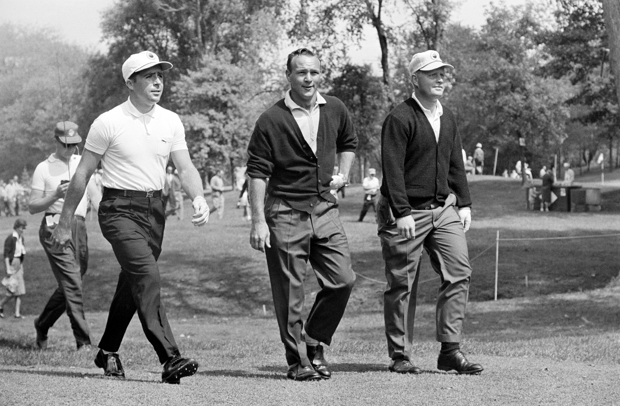 Player on the fairway with Arnold palmer and Jack Nicklaus.