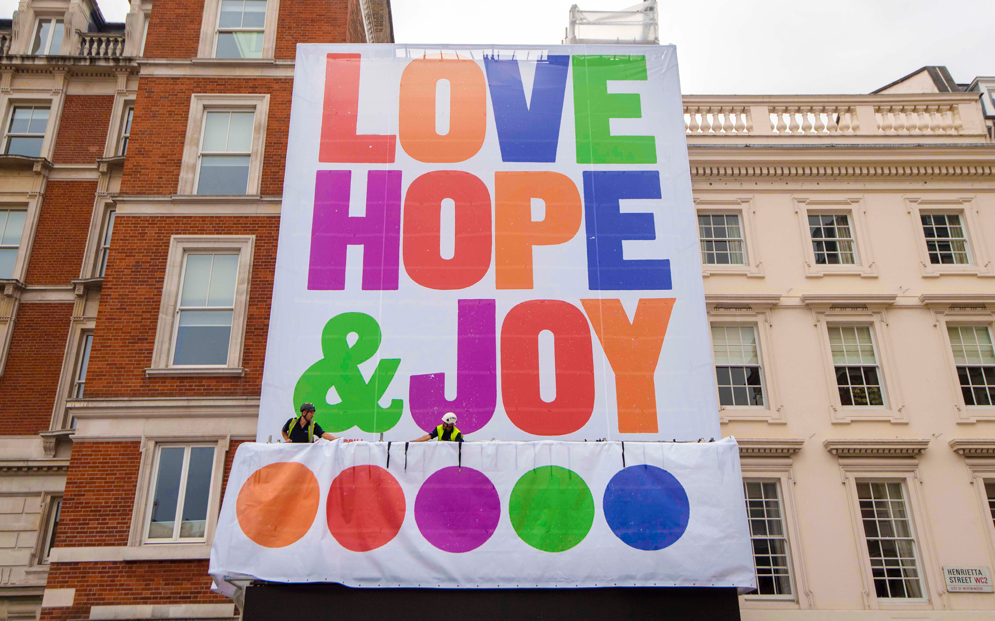 Anthony Burrill's Love, Hope & Joy on display in Covent Garden piazza