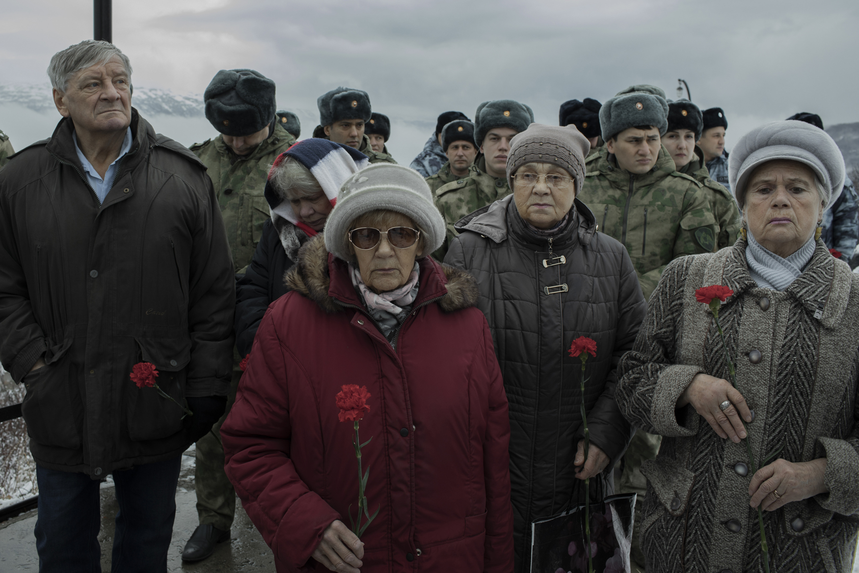 MAGADAN, Russia - 30 October, 2019. Descendants of victims of political repression commemorate those who died in the Soviet forced labour camps of the Kolyma region. At the 'Mask of Sorrow' monument, which stands above the city of Magadan, they are joined by officials and service members. © Emile Ducke Kolyma, Along the Road of Bones