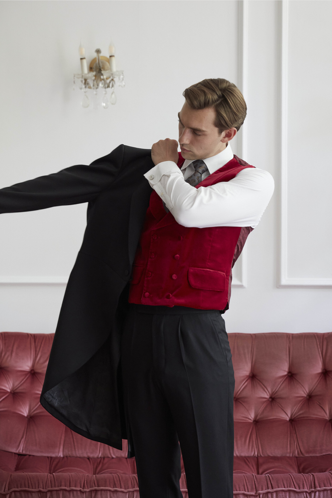 Add a doublebreasted red waistcoat to traditional black cashmere for a pop of colour and personality