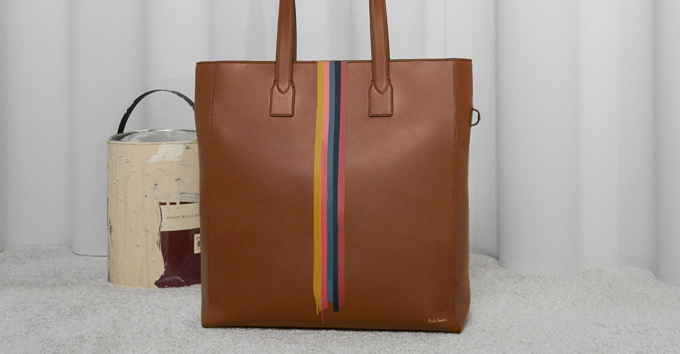 Artist Stripe tote bag, £795. Opposite, from top Biker jacket, £2,300; wallet, £190; trainers, £285, all Paul Smith