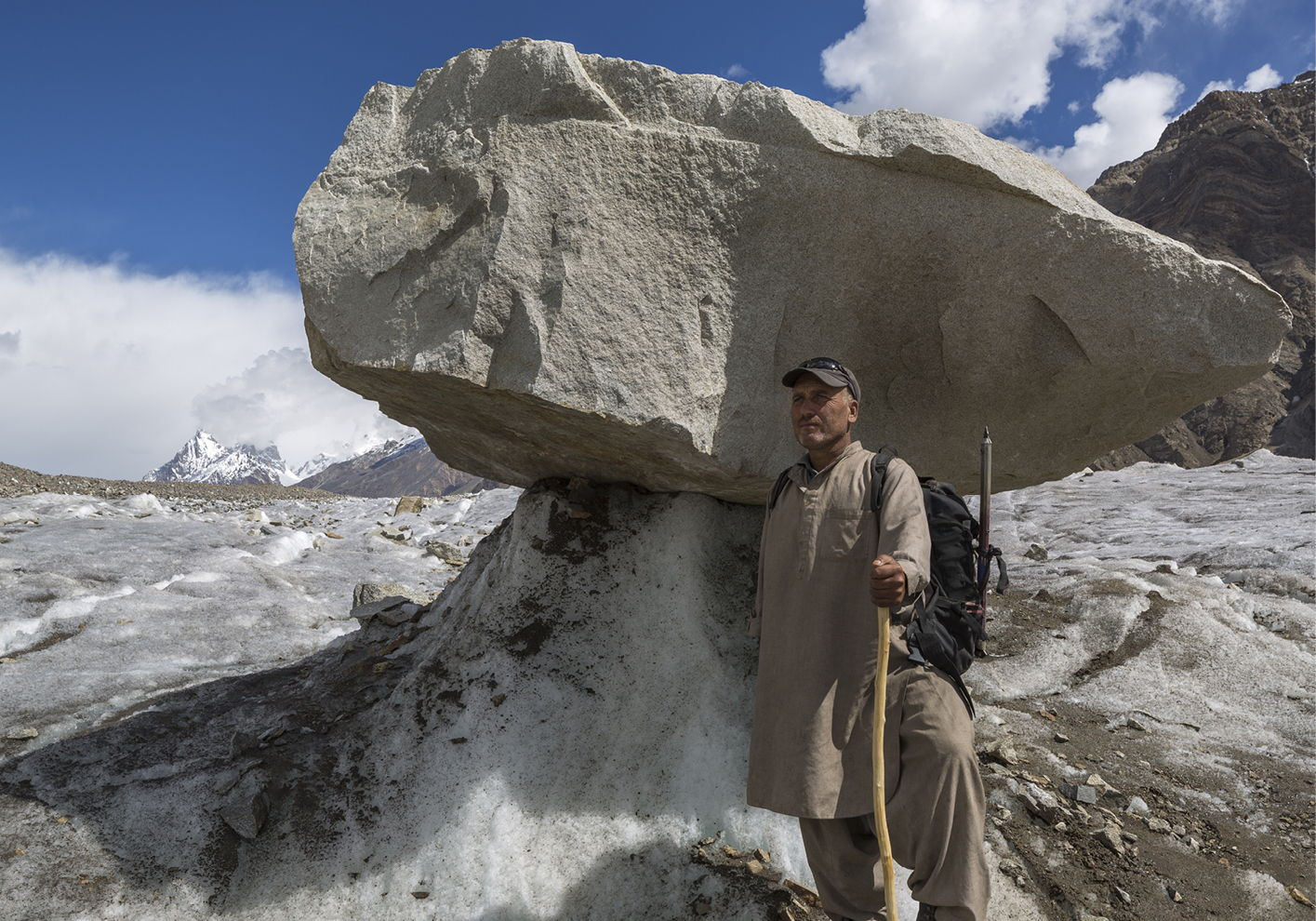 Porter Karim with a glacier table on the Biafo Glacier