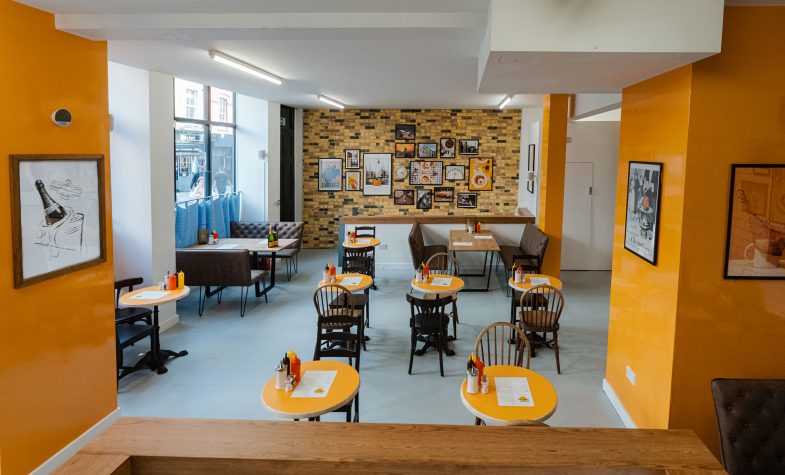 The yellow inflected Sunny Side Up Café by Veuve Clicquot