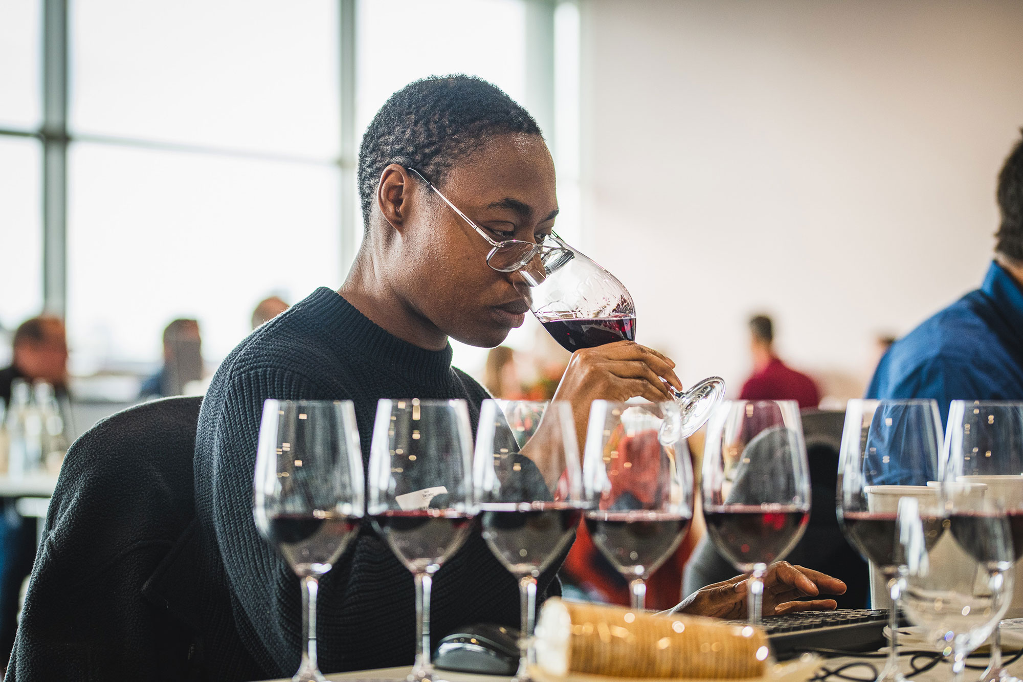 A judge at the Decanter World Wine awards tasting a flight of wine
