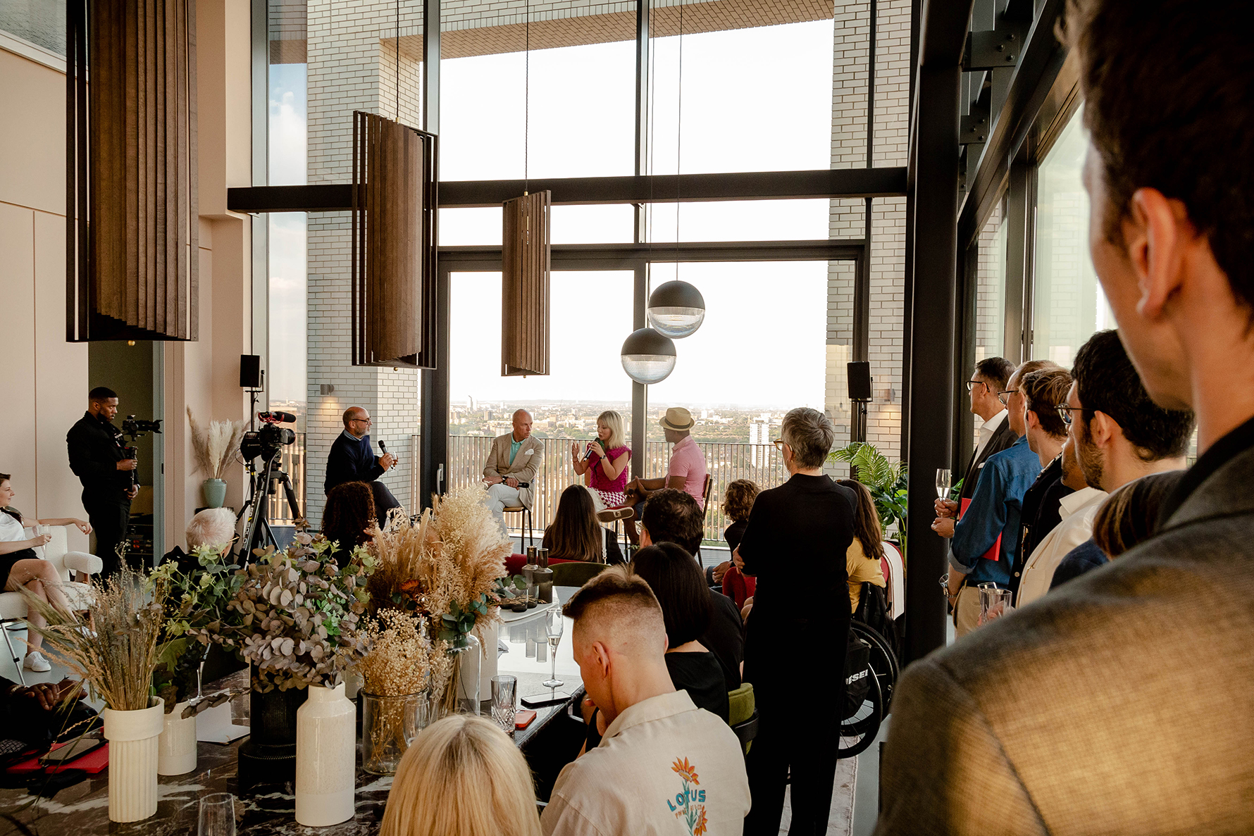 The crowd gathers in the Penthouse at London City Island to hear from the panel
