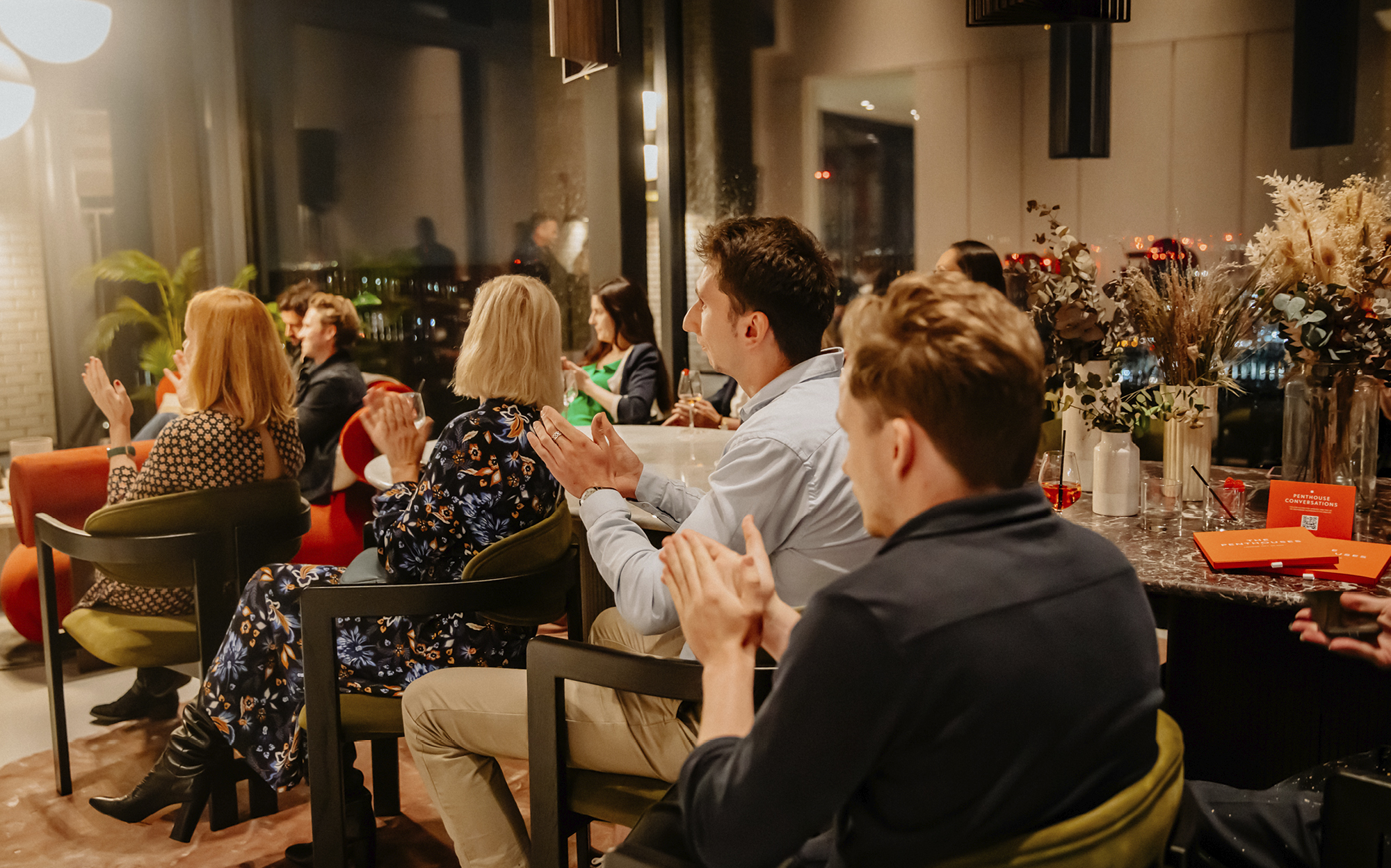 Audience members applaud the panelists, who seamlessly combined their varied knowledge and experiences for an engaging discussion