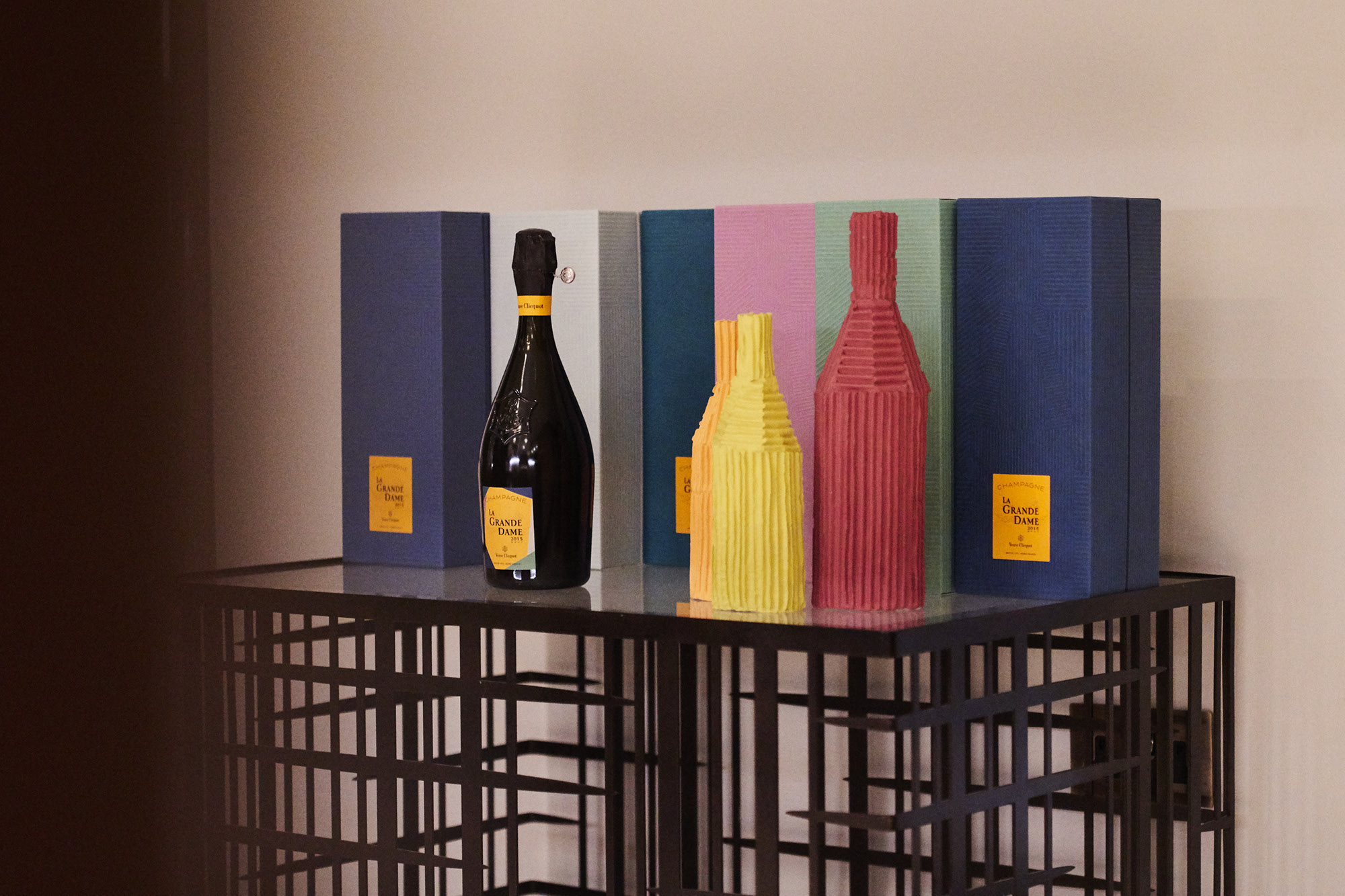The collaboration features a collection of six cases made from corrugated cardboard