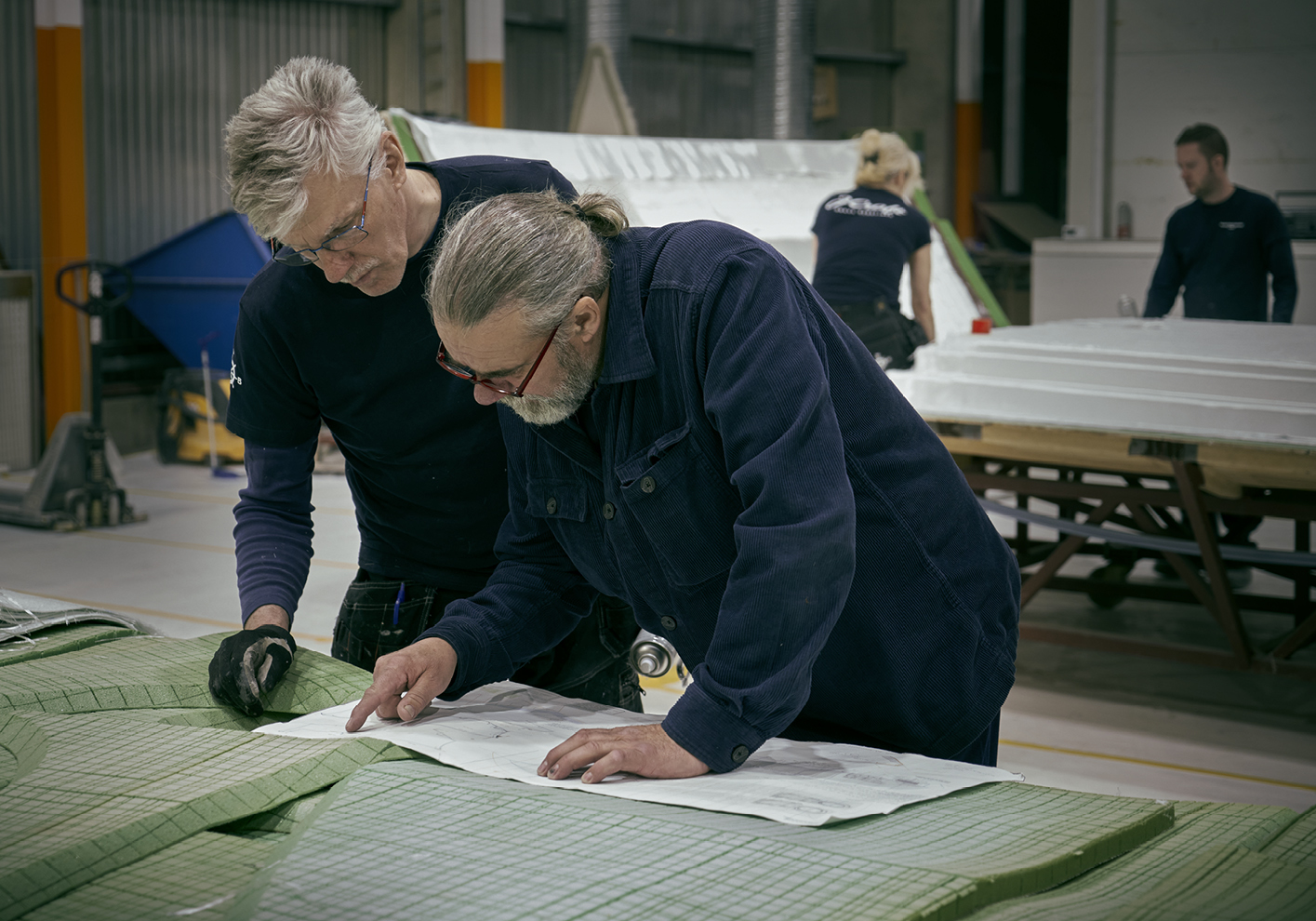 Johan Hallén (right) checks over plans. 