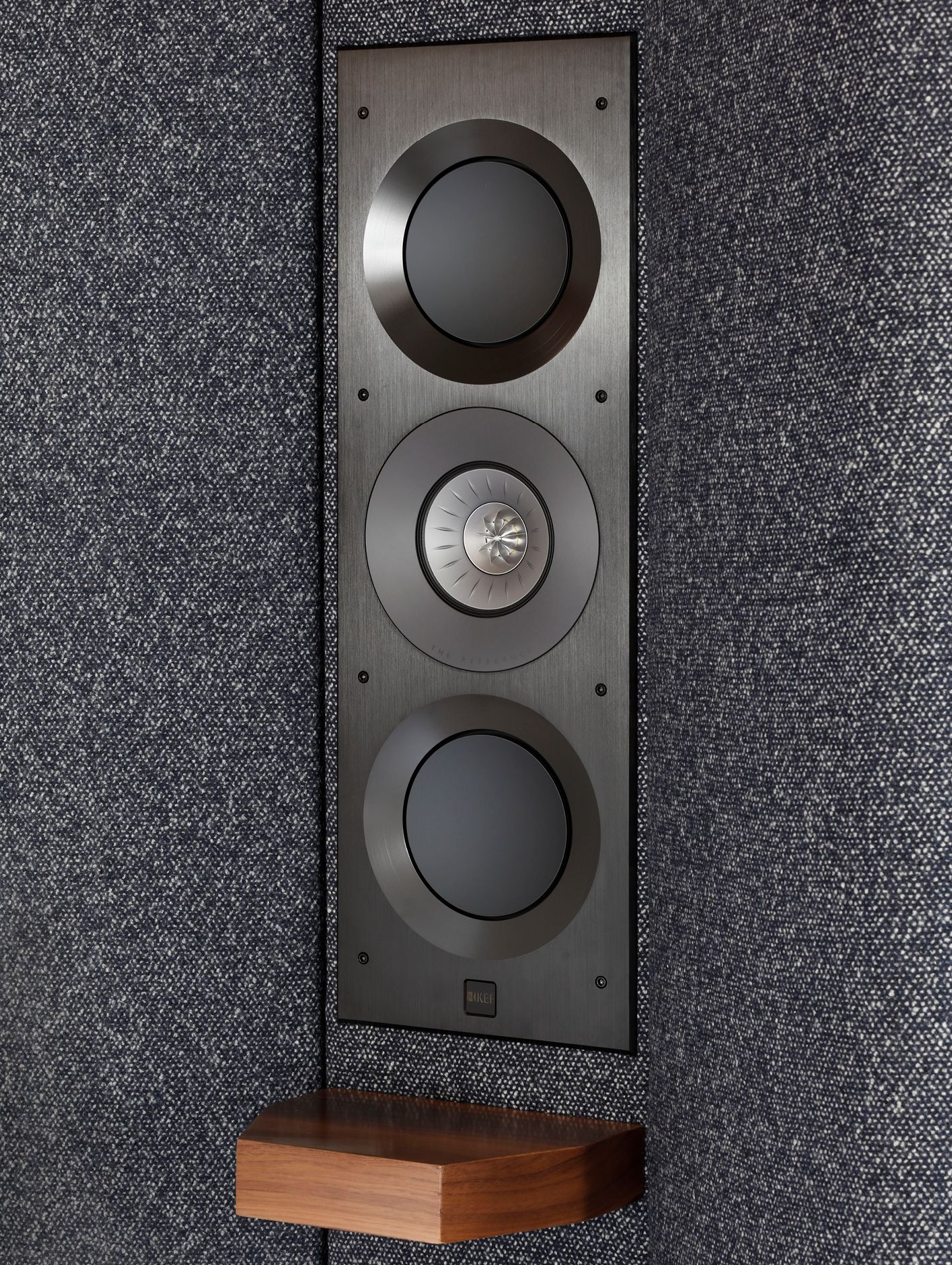 One of two KEF Ci3160REFM-THX speakers integrated into the curved headboard of the Seventy Five