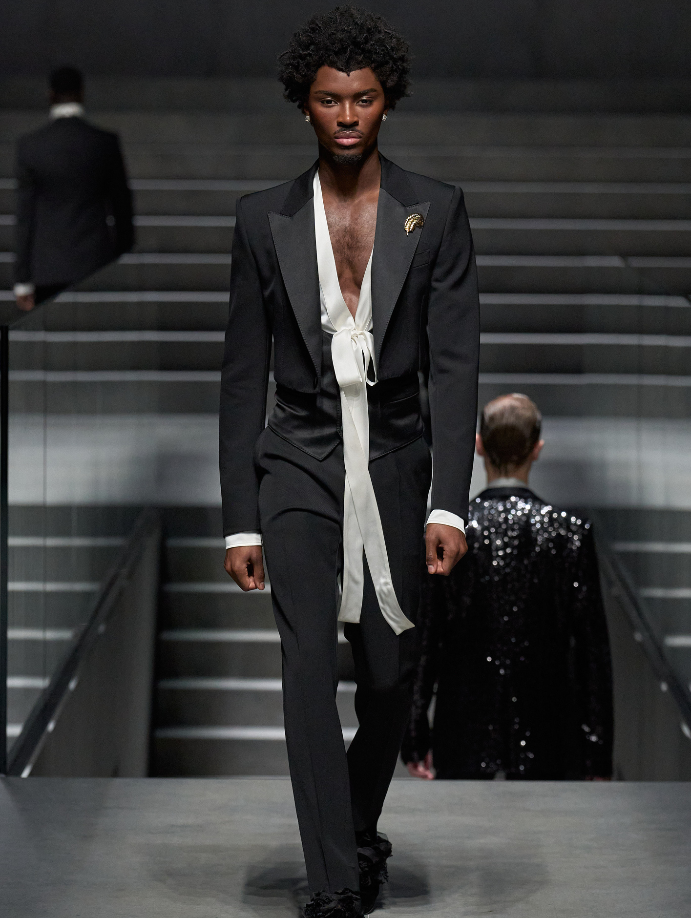 Accessories including fluttering bows added a dramatic touch to structured tuxedos