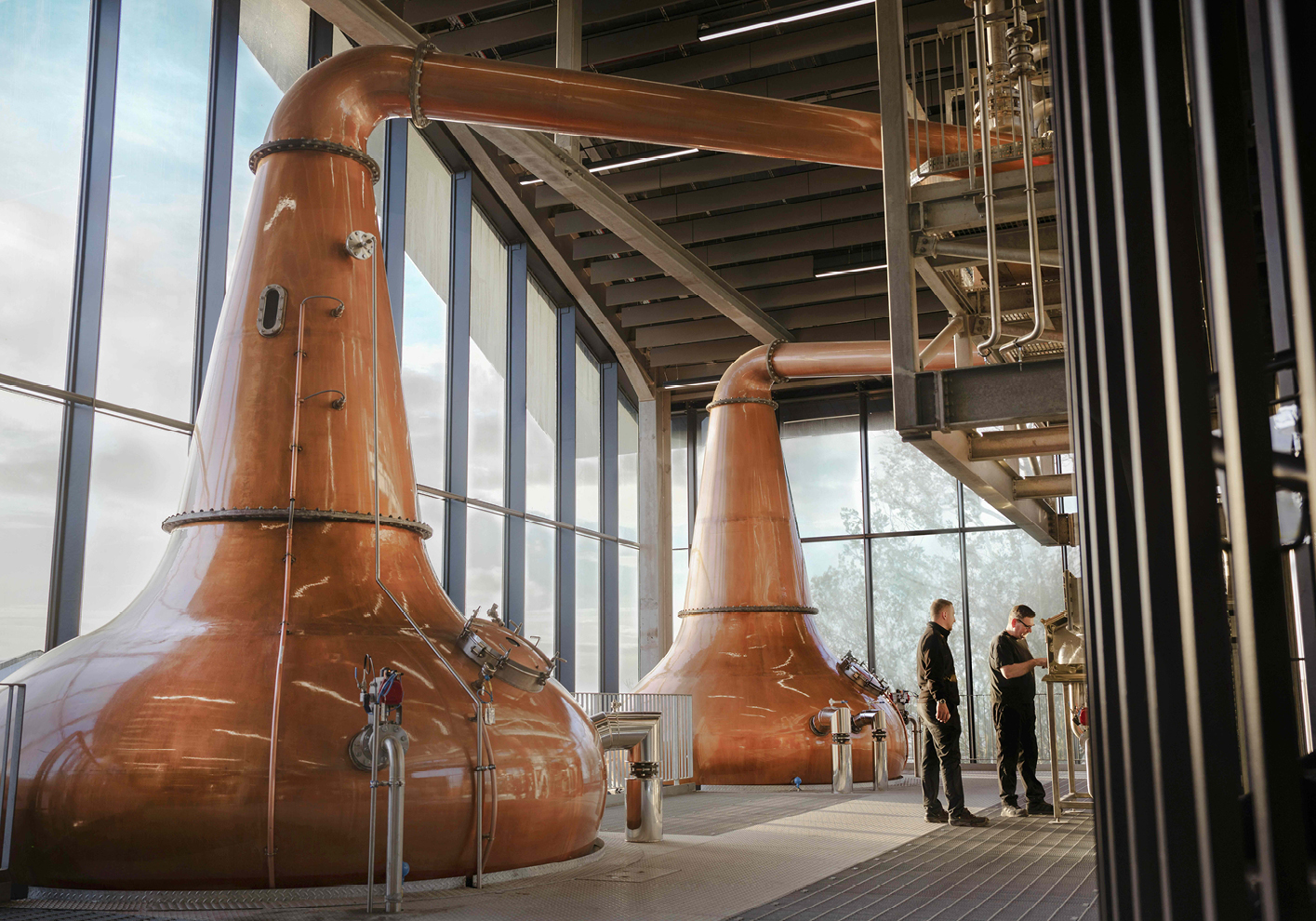 Distillery workers take the cut at the spirit safe at Port Ellen Distillery