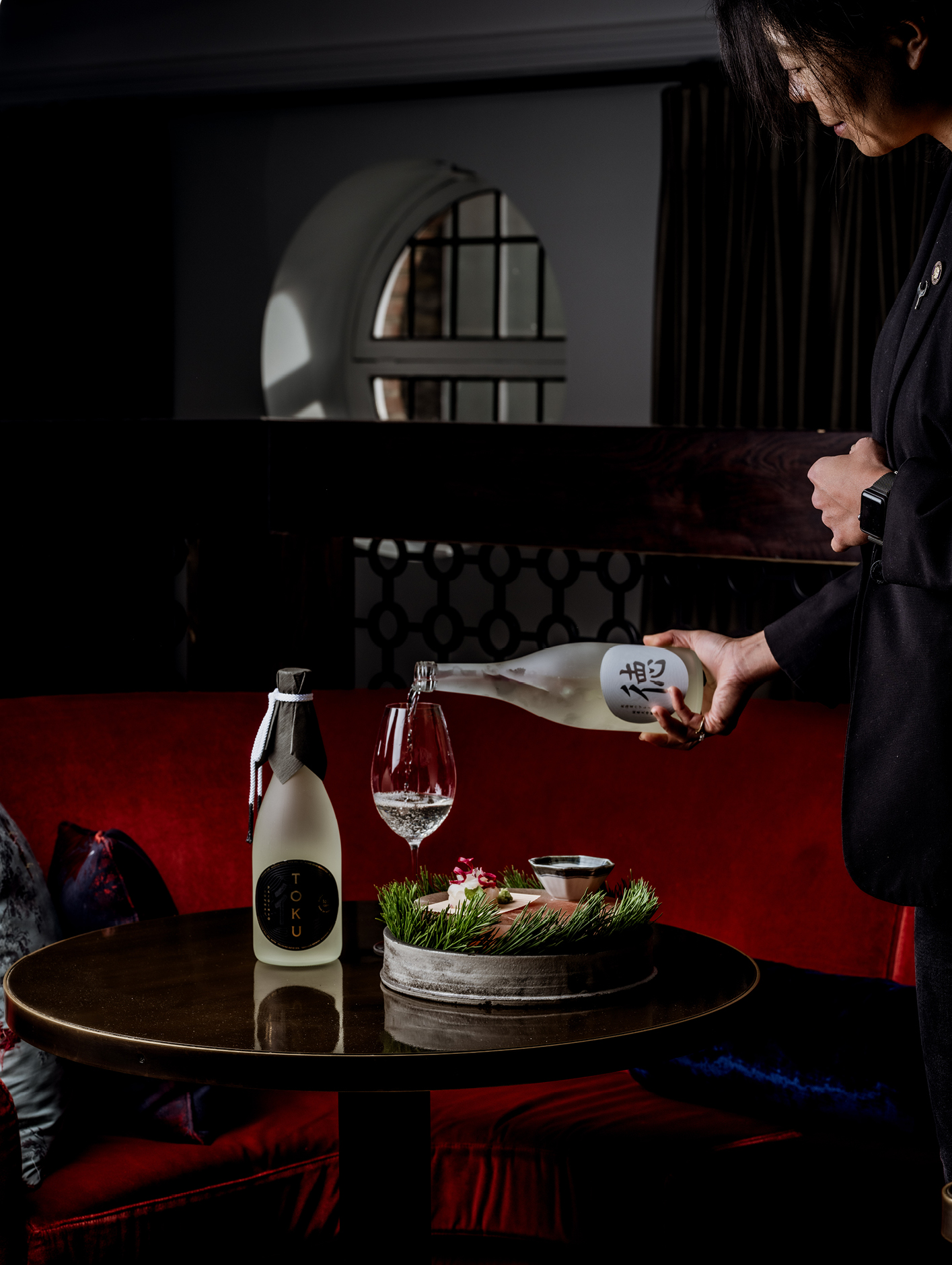 Jiachen Lu, sommelier at Japanese restaurant Dinings SW3, pouring Toku Saké