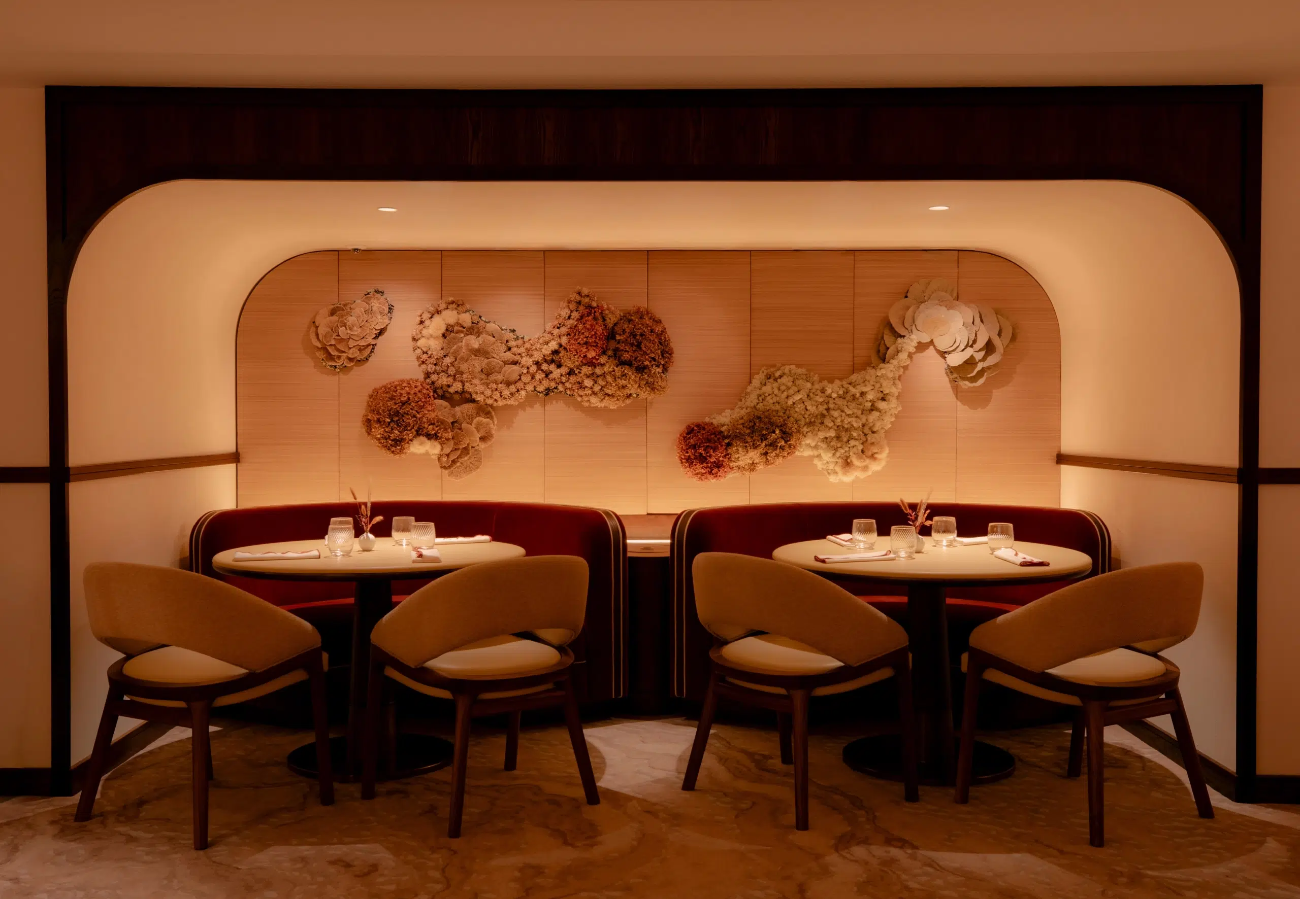 The dining room at Bonheur in muted orange tones