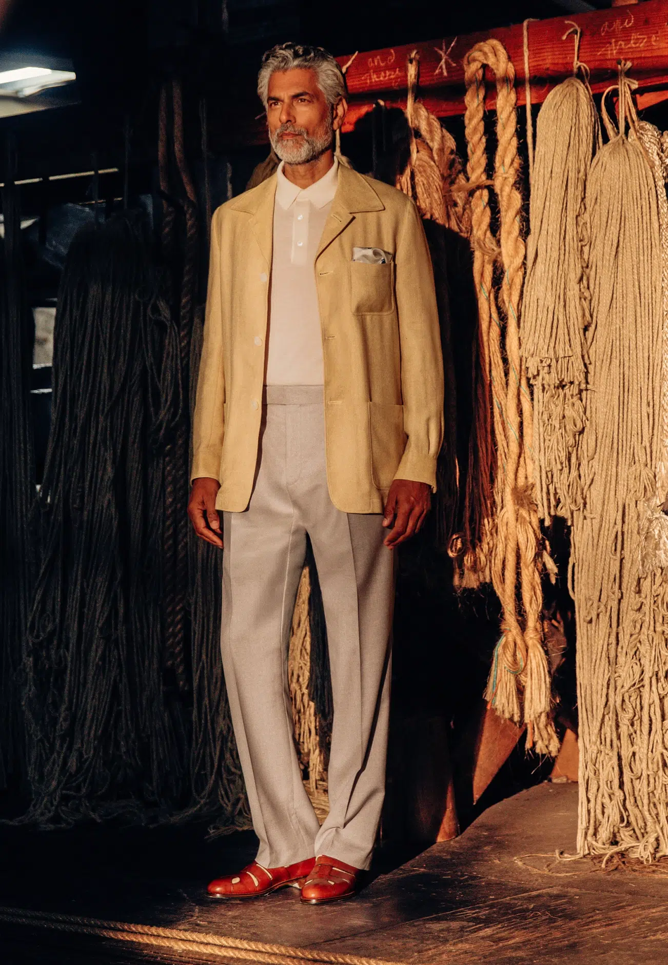Model wearing yellow Gieves & Hawkes suit