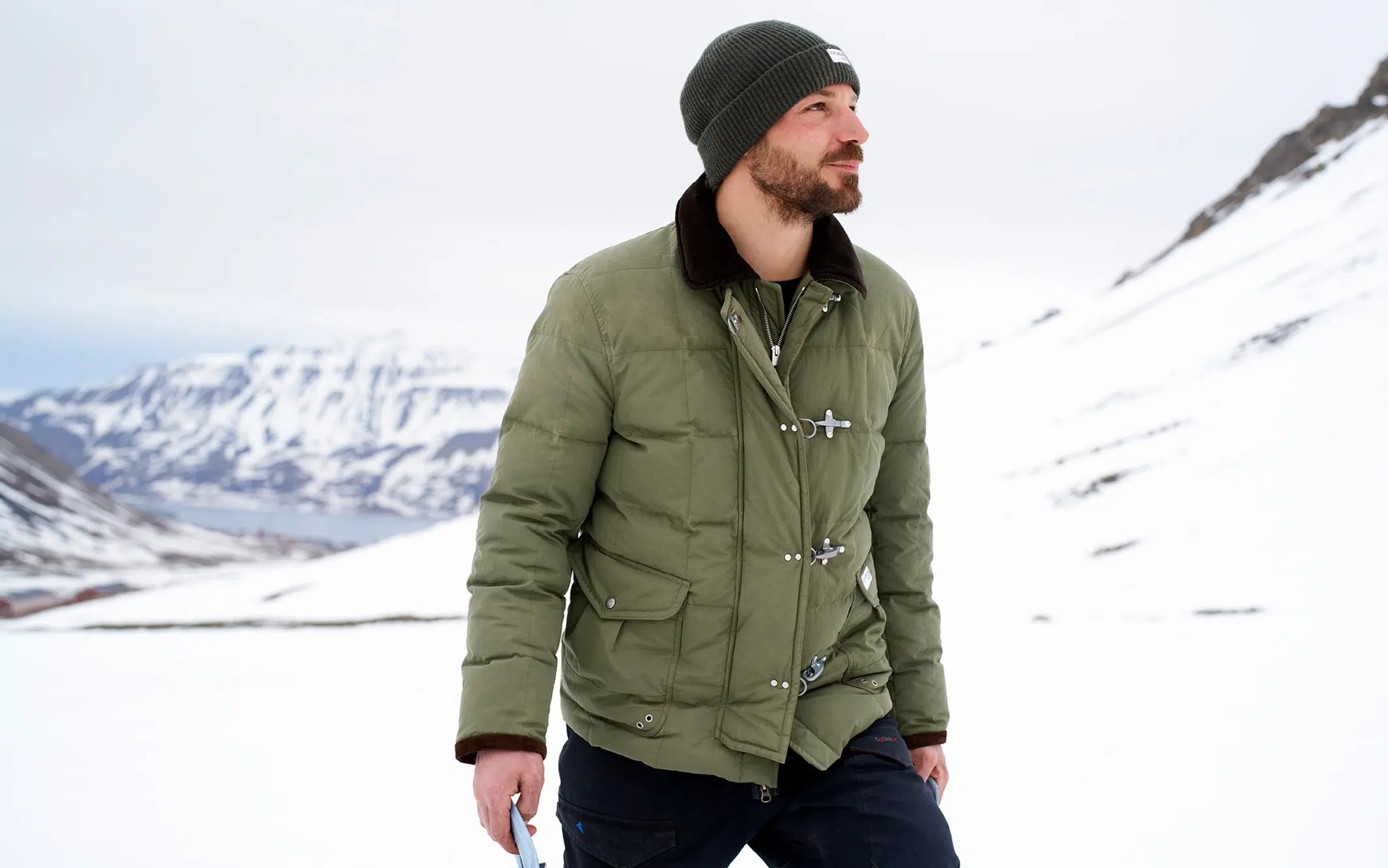 Man wearing Faye jacket in Norwegian glacier