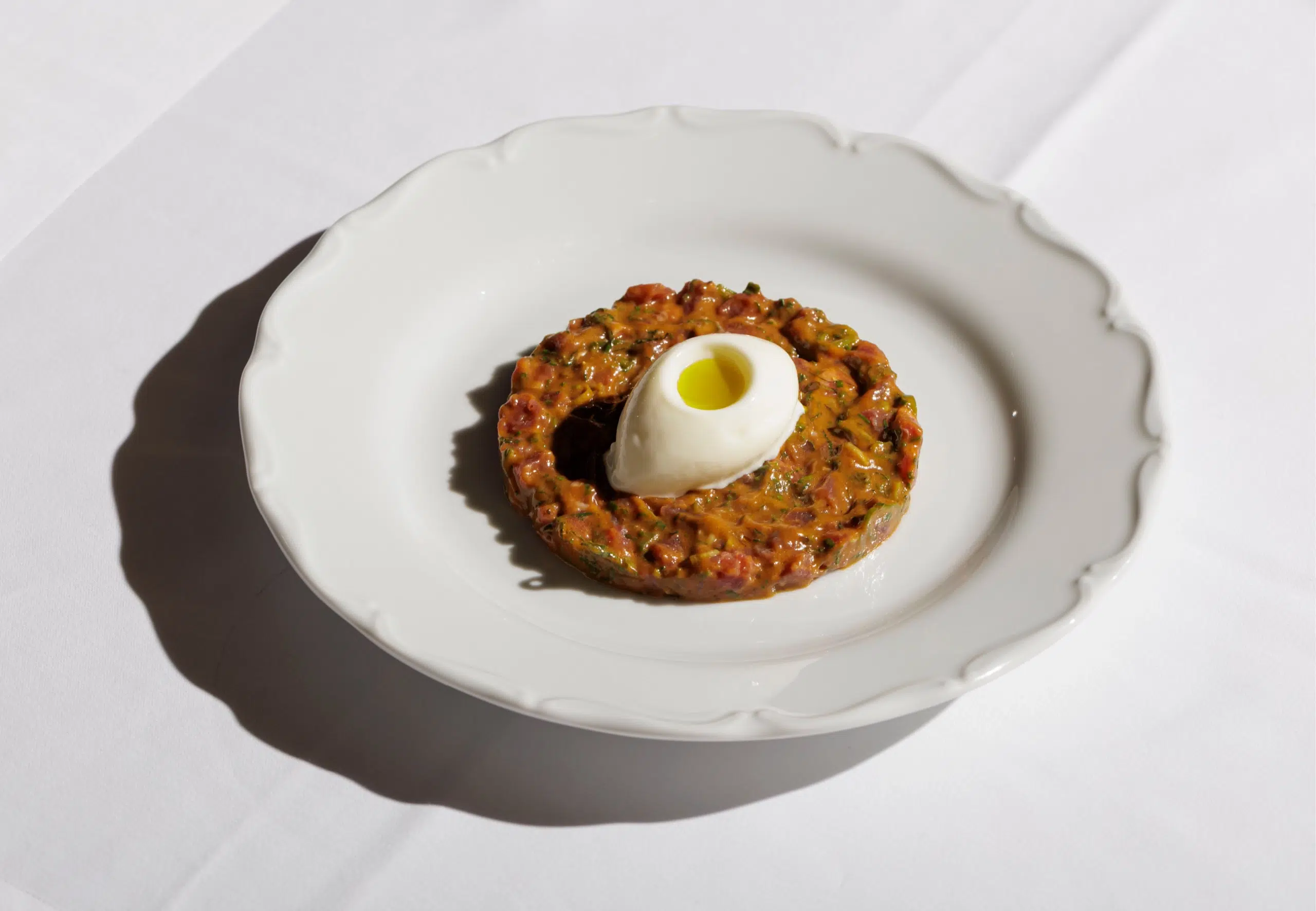 Steak tartare with graviera cheese ice cream